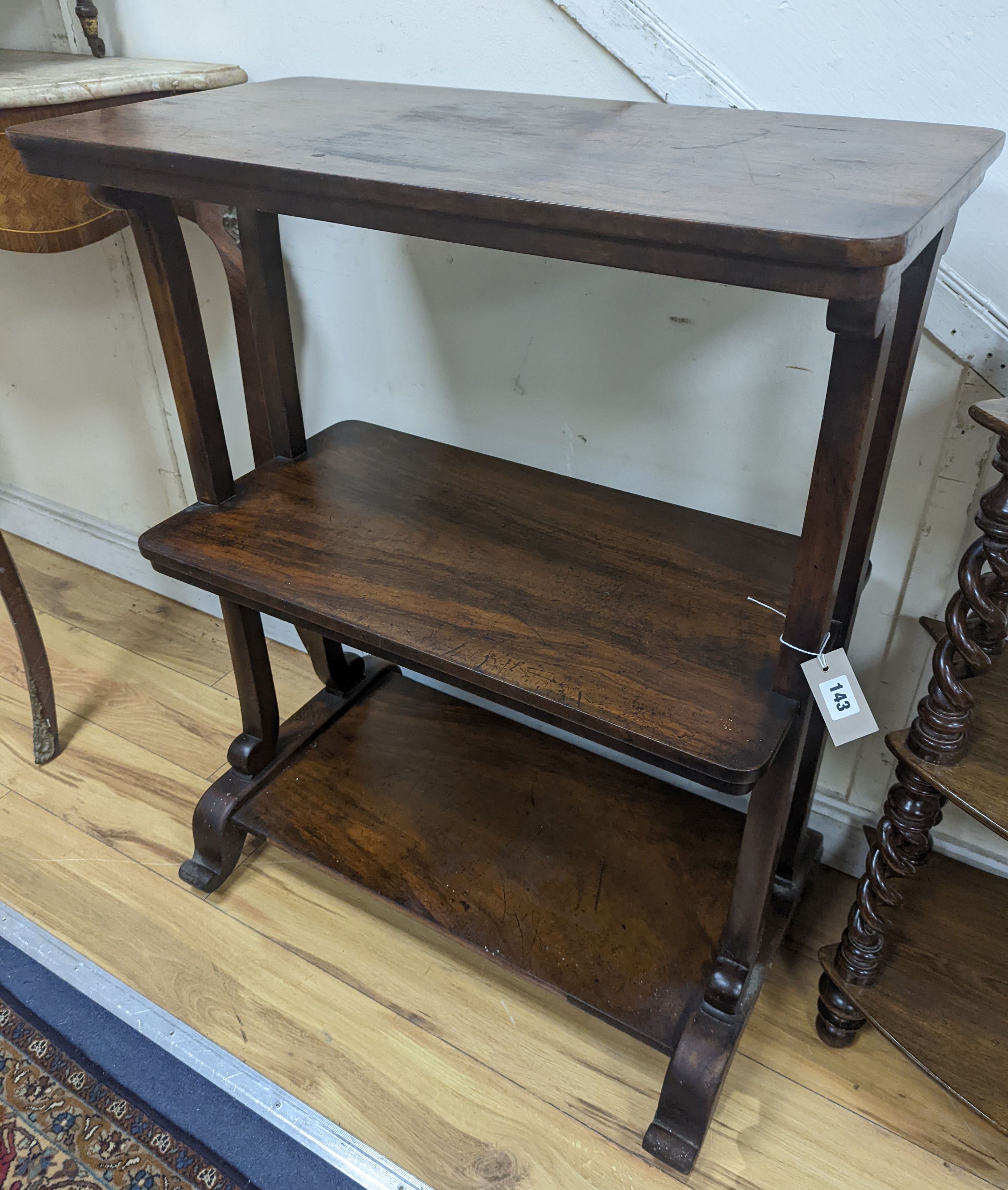 A Victorian rosewood three tier table. W-73cm, D-38cm, H-92cm.